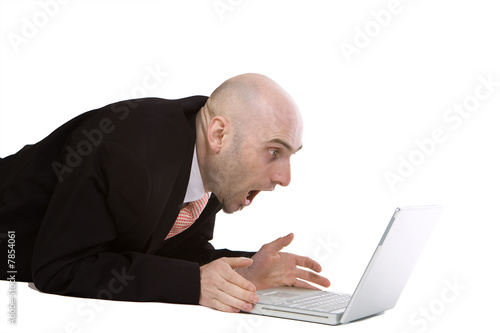 Photo: Amazed businessman using laptop Amazed businessman using laptop
