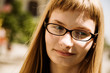 young woman with glasses