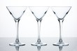 Three empty martini glasses