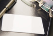 _White business card lays on organizer_