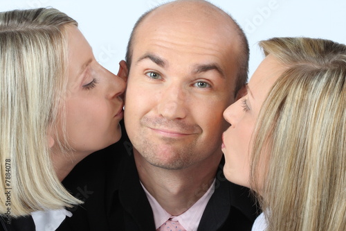 Photo: Successful Businessteam - Kiss for the boss Successful Businessteam - Kiss for the boss