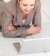 Woman lying in front of laptop