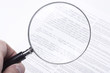 Photo: Hand showing confusing fine print Hand showing confusing fine print