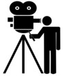 stick man or figure standing behind movie camera 