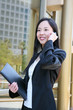 Asian Business Woman on Phone at Office Building