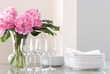 white dishes, wine glasses & peonies - entertaining at home