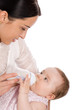Mother feeding baby daughter