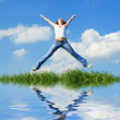 Foto: happy young woman is jumping happy young woman is jumping
