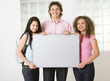 Three friends with blank table
