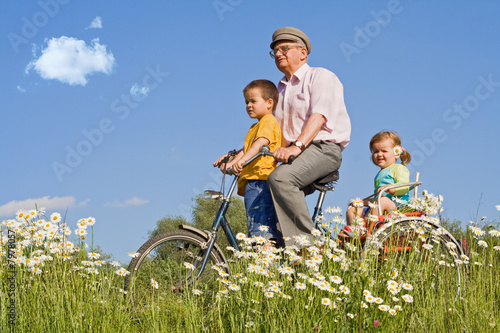 Photo: Riding with grandpa on a bike Riding with grandpa on a bike