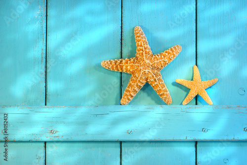 Photo: Starfish on an old rustic door Starfish on an old rustic door