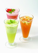 Three fruit glasses on white background