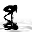 Asian model stretching by the water Asian model stretching by the water