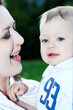 Mother and baby boy embrace