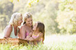 Grandmother with daughter and grandchild on picnic