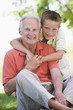 Grandfather and grandson smiling