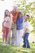 Grandparents laughing with grandchildren