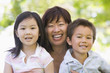 Grandmother laughing with grandchildren