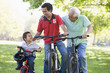 Grandfather son and grandson bike riding