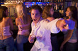 Young man in nightclub showing off for the camera
