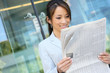 Asian Business Woman Reading Newspaper Asian Business Woman Reading Newspaper