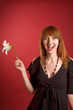 Surprised girl with flower in hand Surprised girl with flower in hand