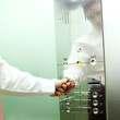 A businessman calling a lift