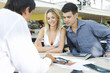 A young couple buying a new car