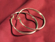 Silver Earings on Red Blanket