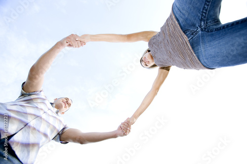Photo: Two young lovers holding hands Two young lovers holding hands