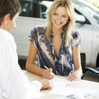 A young woman buying a new car