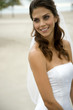 A bride standing on a beach