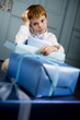 ginger haired boy with lots of presents