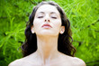 Beauty portrait of a woman in a tropical setting.