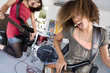 Photo: Three teenage girls (15-17) in garage band, teenage girl playing electric guitar in foreground Three teenage girls (15-17) in garage band, teenage girl playing electric guitar in foreground