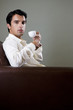 Portrait of a man drinking from an espresso cup