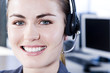Smiling businesswoman in a call centre
