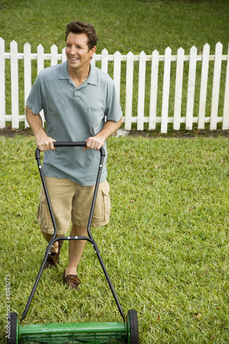 Photo: man mowing the lawn man mowing the lawn