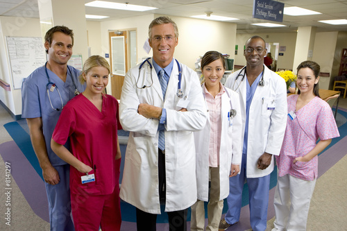 Photo: Hospital staff standing in ward, smiling, portrait Hospital staff standing in ward, smiling, portrait