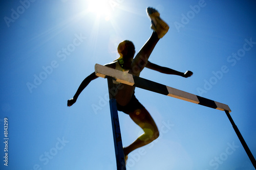 Foto: Female hurdler in action Female hurdler in action