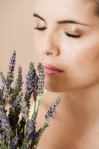 Photo: Woman holding a bunch of dried lavender Woman holding a bunch of dried lavender