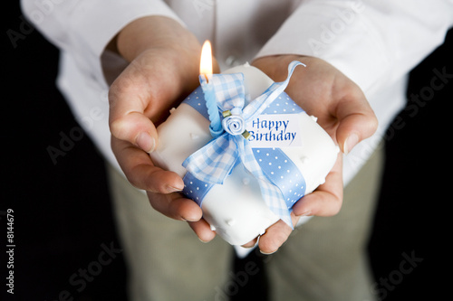 Photo: close up shot hands holding miniature birthday cake close up shot hands holding miniature birthday cake