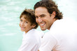 portrait of father and son by water