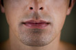 Portrait of a young man's mouth and jaw line