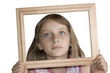 Young beautiful girl with frame