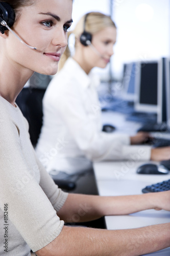 Photo: Two businesswomen in a call centre Two businesswomen in a call centre