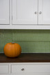 Orange Hallowe'en pumpkin on a kitchen counter