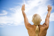 Rear view nude woman, arms raised