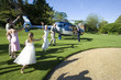 Photo: Usher, bridesmaid and flower girl (10-12) waving at senior bride and groom preparing to board helicopter Usher, bridesmaid and flower girl (10-12) waving at senior bride and groom preparing to board helicopter