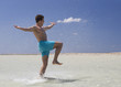 A man splashing in the sea